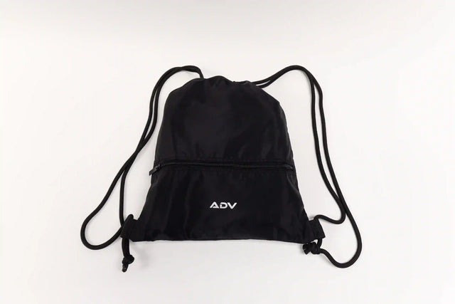 ADV black drawstring tennis bag with front zipper pocket and white logo on a clean white background.