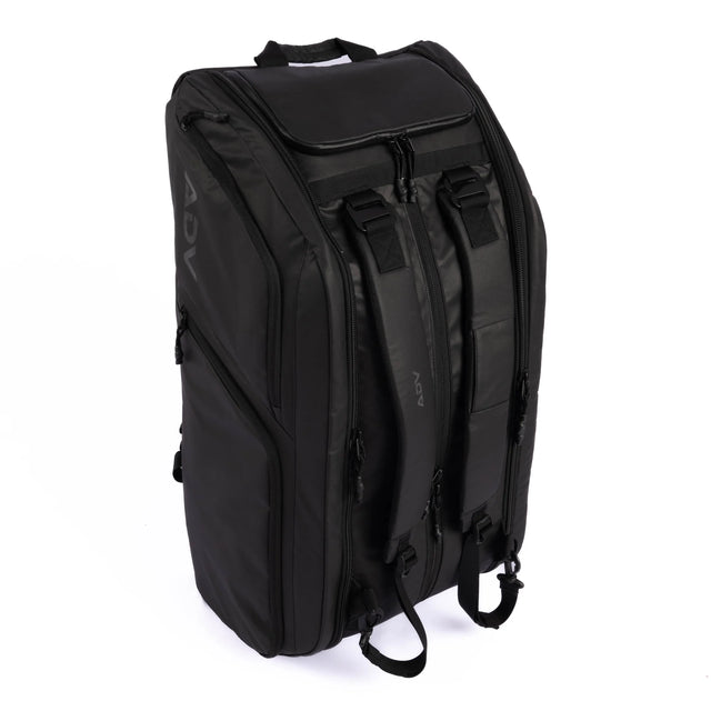 Black ADV Pro V3 tennis backpack with padded straps, top handle, and multiple zippered compartments.
