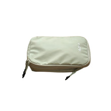 Gray tennis bag featuring a small, structured shape with dual zippers and clean finish.