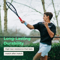 Player swings a tennis racquet gripped with a red FeltTac overgrip built for durability.