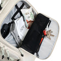 ADV Pickleball Backpack V2 quick-access pocket in Dune tan, packed with phone, keys, snack, and sock