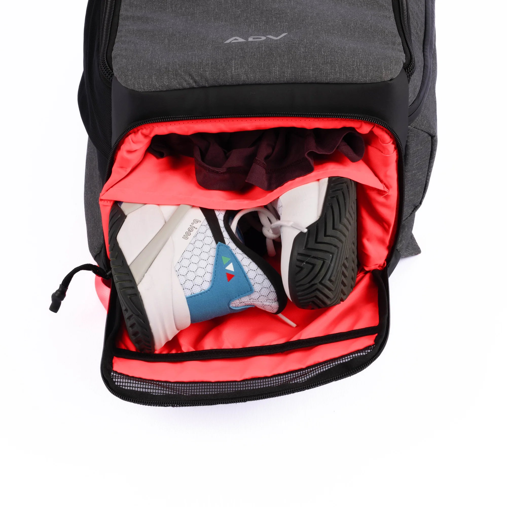 Gray tennis bag with a bright red shoe compartment, storing athletic shoes and clothing, and featuring ADV branding.