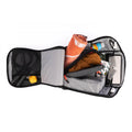 Open tennis bag with gray interior, organized compartments holding a towel, jump rope, laptop, and various accessories.