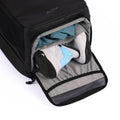 Black tennis bag with a gray shoe compartment, storing athletic shoes and clothing, and featuring ADV branding.