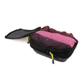 Open ADV packing cube in charcoal nylon with volt zip pulls, packed with clothing.