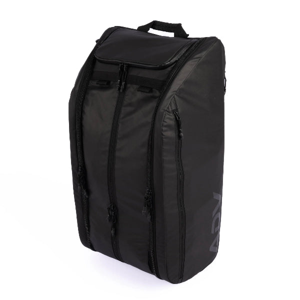 Black racket backpack standing upright with multiple zippered compartments and a sleek, structured design.