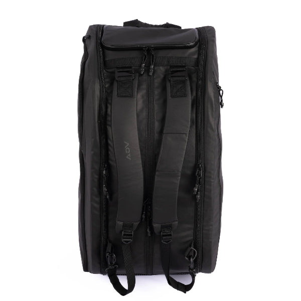 Black tennis backpack with padded adjustable straps, multiple zippered compartments, and a durable, weather-resistant exterior—designed for comfort and functionality on and off the court.