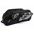 Black tennis racquet bag with multiple compartments open to reveal organized accessories including keys, sunglasses, and grooming items.