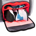 Tennis backpack with shoe compartment shown open with sneakers and clothes inside, featuring a ventilated mesh flap and bright interior lining for organized, odor-contained storage.