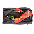 Tennis racquet backpack with open top compartment showing towel, string, grip, balls, and accessories inside.