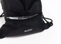 Black ADV drawstring bag detail showing the open zippered front pocket with silver interior lining.
