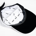 Inside view of ADVantage tennis cap showing branded sweatband lining and black underbrim.