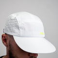 White ADVantage tennis cap with volt logo and perforated side panels, worn on-model.