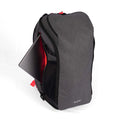 Gray tennis bag with a dedicated laptop compartment, featuring bright red interior accents and a sleek, modern design.