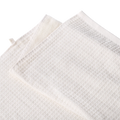 White waffle-knit tennis towels with a soft textured weave on a transparent background.