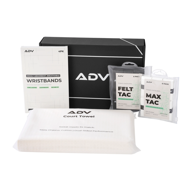 ADV tennis starter kit flat lay with gift box, wristbands, Felt Tac and Max Tac overgrips, and court towel.