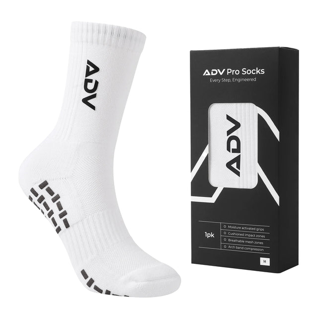 White ADV Pro Tennis Sock in size M with grip sole displayed next to its black retail packaging.