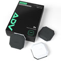 ADV Touch tennis dampeners in black, grey, and white beside their 3-pack box.