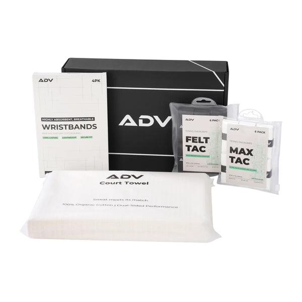ADV tennis accessories kit: wristbands, overgrips, and court towel beside a black gift box.