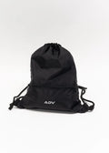 Black ADV Dash drawstring bag with front zip pocket on white background.
