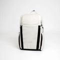 Cream ADV Flex Backpack with black side straps, front view for tennis and pickleball gear.