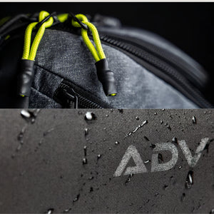 Close-up of a backpack with yellow drawstrings and water droplets on fabric.